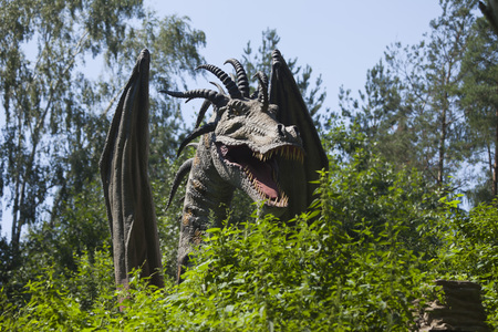 MOCISKA, POLAND - August 8: Dragon model in amusement part "Farma iluzji", Poland on August 8th 2016のeditorial素材