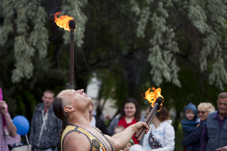 WARSAW, POLAND, June 1: Juggler with blazing torches during a performance on "Children's Day" party June 1, 2017 in Warsaw, Poland.のeditorial素材
