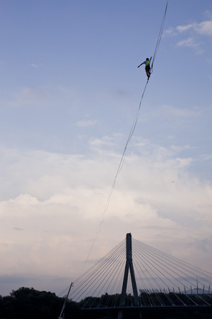 Warsaw, Poland- September 9, 2018: equilibrist walking on the rope above the Vistula river during Vistula Festのeditorial素材