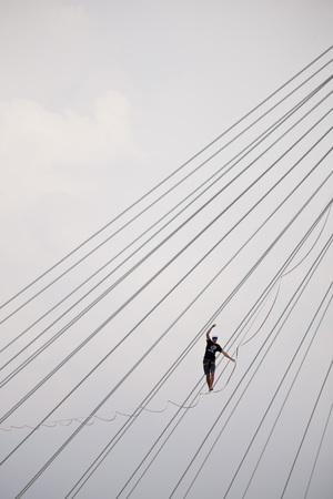 Warsaw, Poland- September 9, 2018: equilibrist walking on the rope above the Vistula river during Vistula Festのeditorial素材
