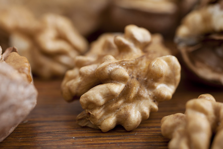 Walnuts on wooden background