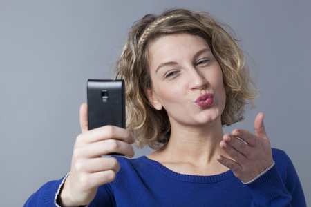 love and humor from selfie on smartphonesの写真素材