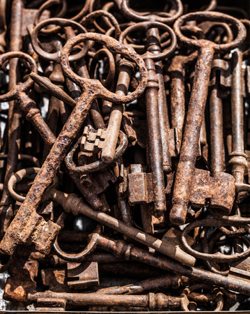 beautiful display of vintage rusted big keys for texture or collection fan sold at flea market or garage sale for antique collectionの写真素材