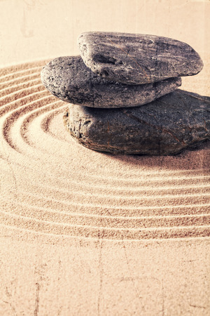 zen still life for spa and massage with sand and stones for relaxation and meditation with textured and contrast effectsの写真素材