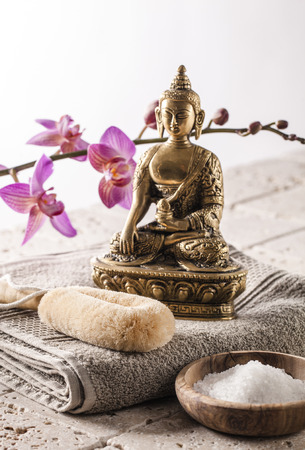 still-life wellbeing - energetic exfoliation setting with Buddha and bath salt for vitality and spirituality at detox spaの写真素材