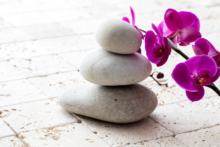 symbol of mindfulness, meditation and elegance with stack of balancing stones or pebbles over...