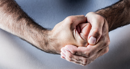 concept of hand gesture for symbol of courage, power, conviction, union or impatience with both...