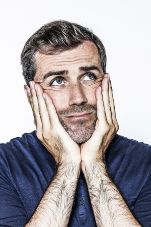 contemplative body language for thinking middle aged handsome bearded man looking up for critical solution, white background studioの写真素材