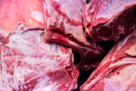 closeup of fresh raw meat of pork or lamb for animal protein nutritionの写真素材