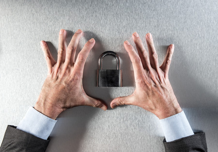 concept of professional security and data confidence with businessman hands showing and protecting a...