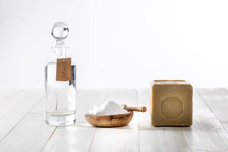 Green domestic housekeeping and sustainable cleaning washing with chic homemade softener made of vinegar and baking soda on copy space wooden backgroundの写真素材