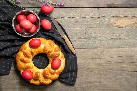 Italian easter bread. Red eggs. Delicious Easter cake. Italy. View from above. Place for text