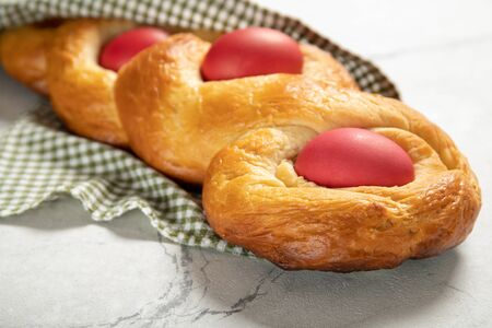 Tasty easter bread. Easter bread and red eggs. Italian easter bread.Close-upの写真素材
