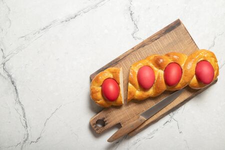 Tasty easter bread. Easter bread and red eggs. Italian easter breadの写真素材