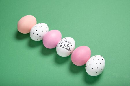 easter eggs on green background, place for text, top view, isolationの写真素材