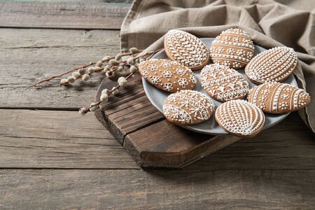 Easter cookies on old wooden background, easter eggs,