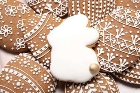 Easter cookies close-up on a white background, place for text, easter eggs, top view, isolation,...