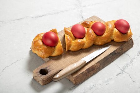 Tasty easter bread. Easter bread and red eggs. Italian easter breadの写真素材