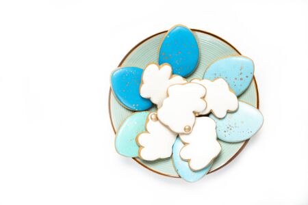 Easter cookies in a plate on a white background, Place for text, Easter eggs, Top view, Isolationの写真素材