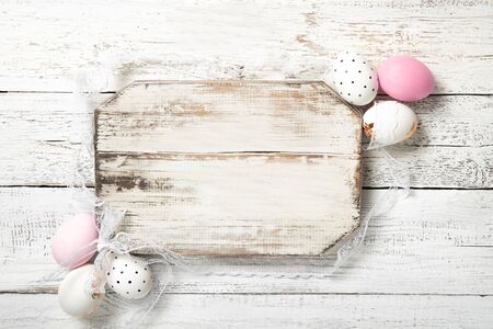 Easter card on a wooden background, Easter eggs, top view, place for text.の写真素材