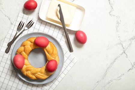 Tasty easter bread. Easter bread and red eggs. Italian easter breadの写真素材