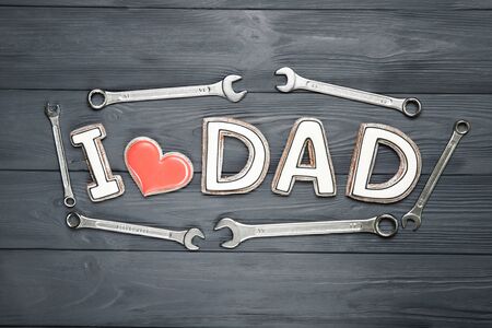 Happy father's day concept. Cookies on a black background. Text i love dad.の写真素材