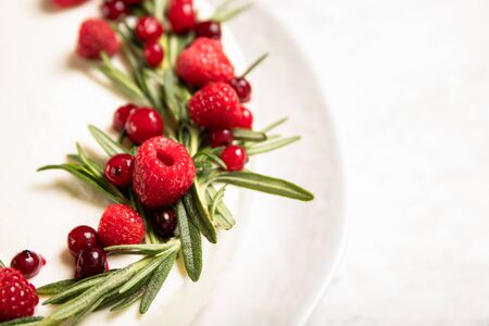 Homemade cheesecake with raspberries on a plate. Close-up
