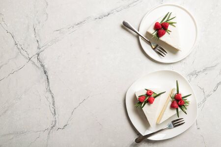 Plate with delicious raspberry cheesecake. On a wooden backgroundの写真素材