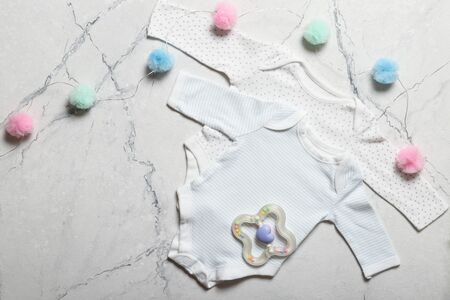 Flat lay composition with baby clothes and accessories 