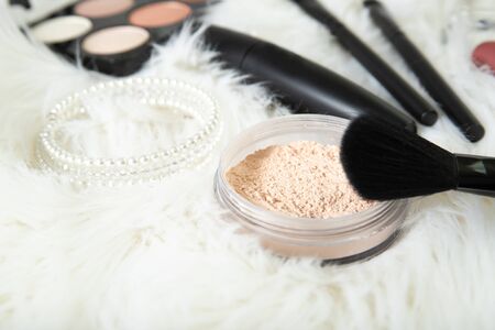 Loose powder and brush close-up. Decorative cosmetics.の写真素材