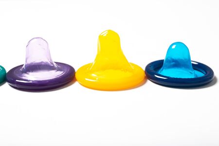Colorful condom on white backgroundの写真素材