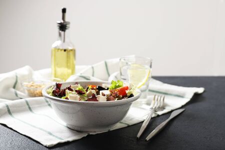 Plate with tasty greek salad of fresh vegetables の写真素材