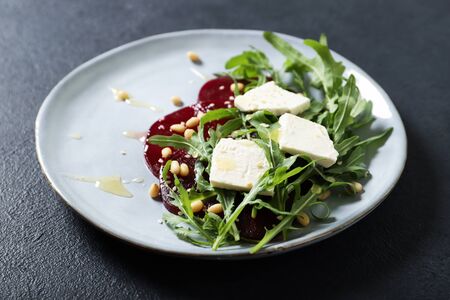 Tasty salad with beetroot and feta. On a black backgroundの写真素材