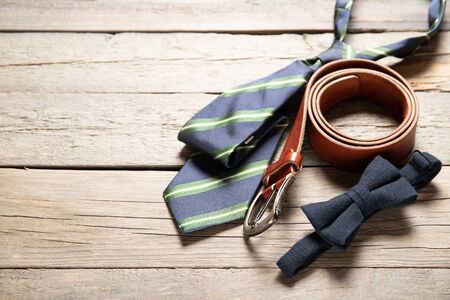 Men's accessories on a wooden background. Place for text. Daddy's Day Holiday Conceptの写真素材
