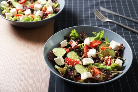 Tasty greek salad with fresh vegetables in a plate.の写真素材