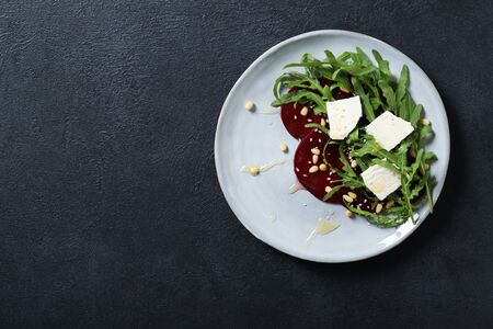Tasty salad with beetroot and feta. On a black backgroundの写真素材