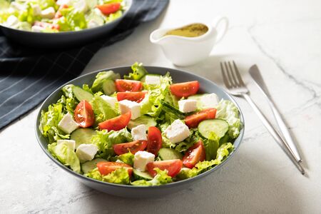 Delicious salad of fresh vegetables and feta.の写真素材
