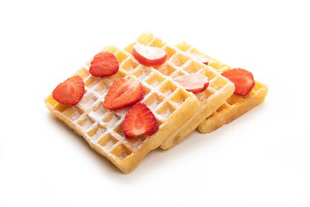 Belgian waffles with fresh strawberries isolated on white backgroundの写真素材