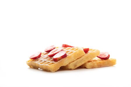 Belgian waffles with fresh strawberries isolated on white backgroundの写真素材
