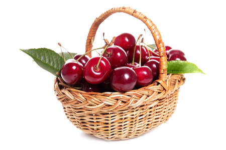 Sweet cherries in a basket isolated on a white backgroundの写真素材