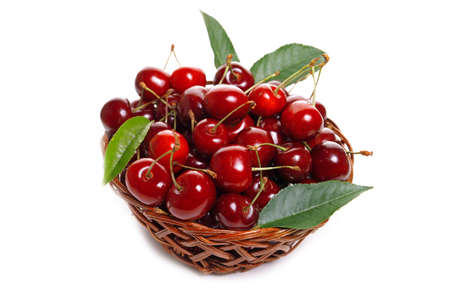 Sweet cherries in a basket isolated on a white backgroundの写真素材