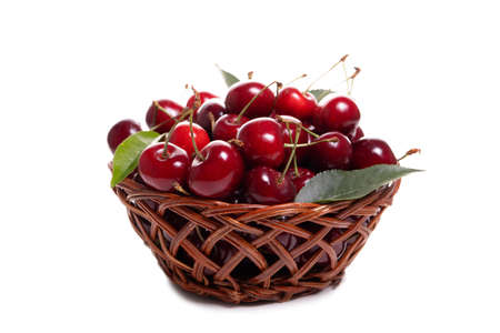 Sweet cherries in a basket isolated on a white backgroundの写真素材