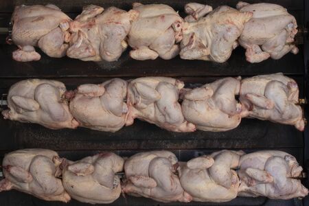 Delicious raw chicken prepared for roastingの写真素材