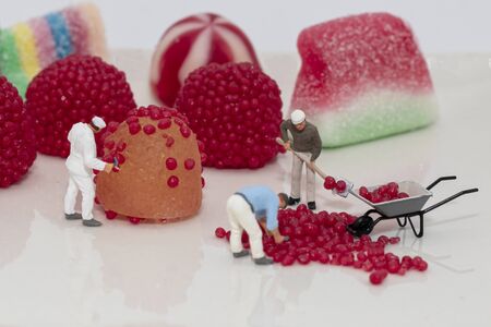 Miniature figures simulating candy makingの写真素材