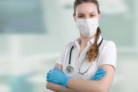 Portrait of a female family doctor in doctor's overall with stethoscopeの写真素材