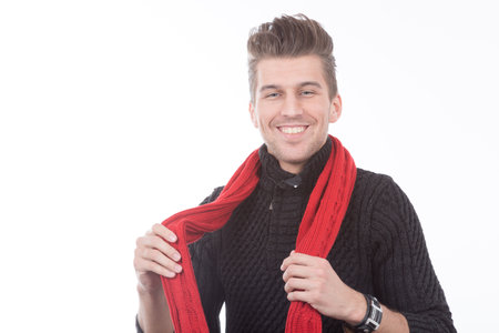 young man in black sweater and red scarfの写真素材