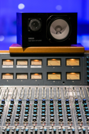 Vintage sound or audio mixer in a recording studio. Knobs, dials and sliders on a soundboard.の写真素材