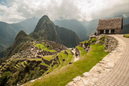 The ancient city of Machu Picchu, Peru. Overlooking ruins on the Inca citadel in the Andes Mountains and the river valley belowの写真素材