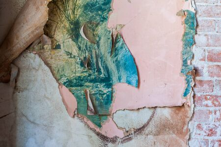 Vintage textures: old wallpaper, peeling paint, brick wall and layers of different colorful backgrounds.の写真素材