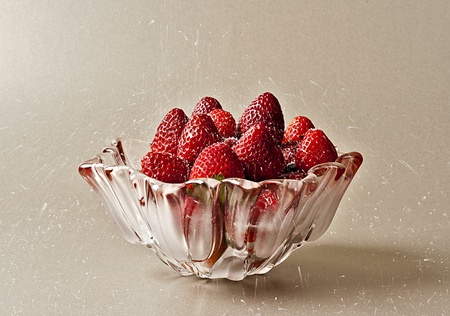 strawberries in a bowl with sugarの写真素材